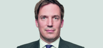 Martin Brand of Blackstone, headshot in dark gray suit