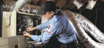 Technician servicing an HVAC system.